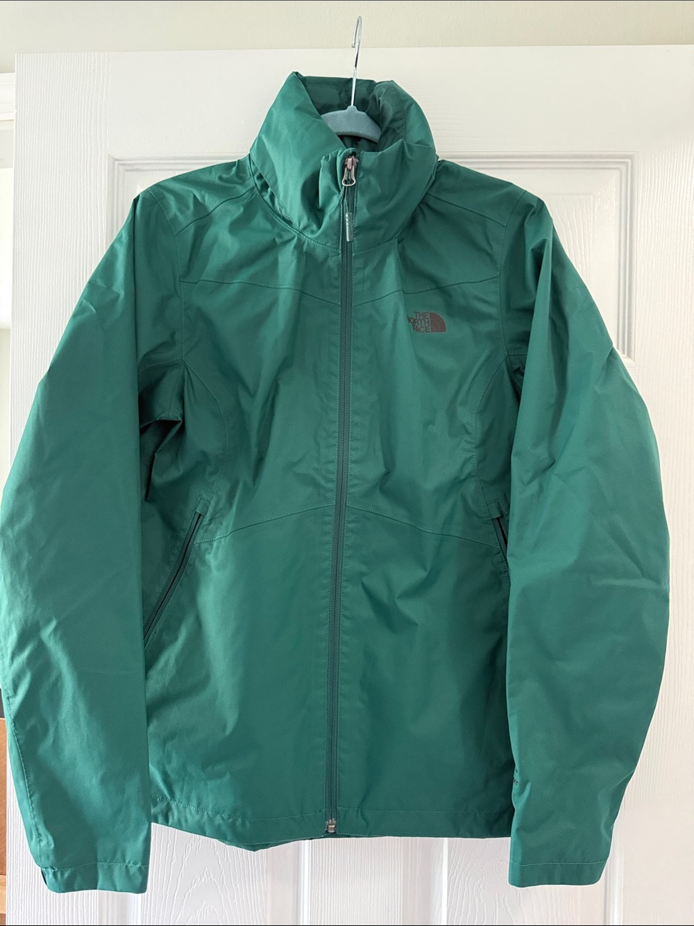 The North Face Women’s Green Lightweight Raincoat w/ Hood.